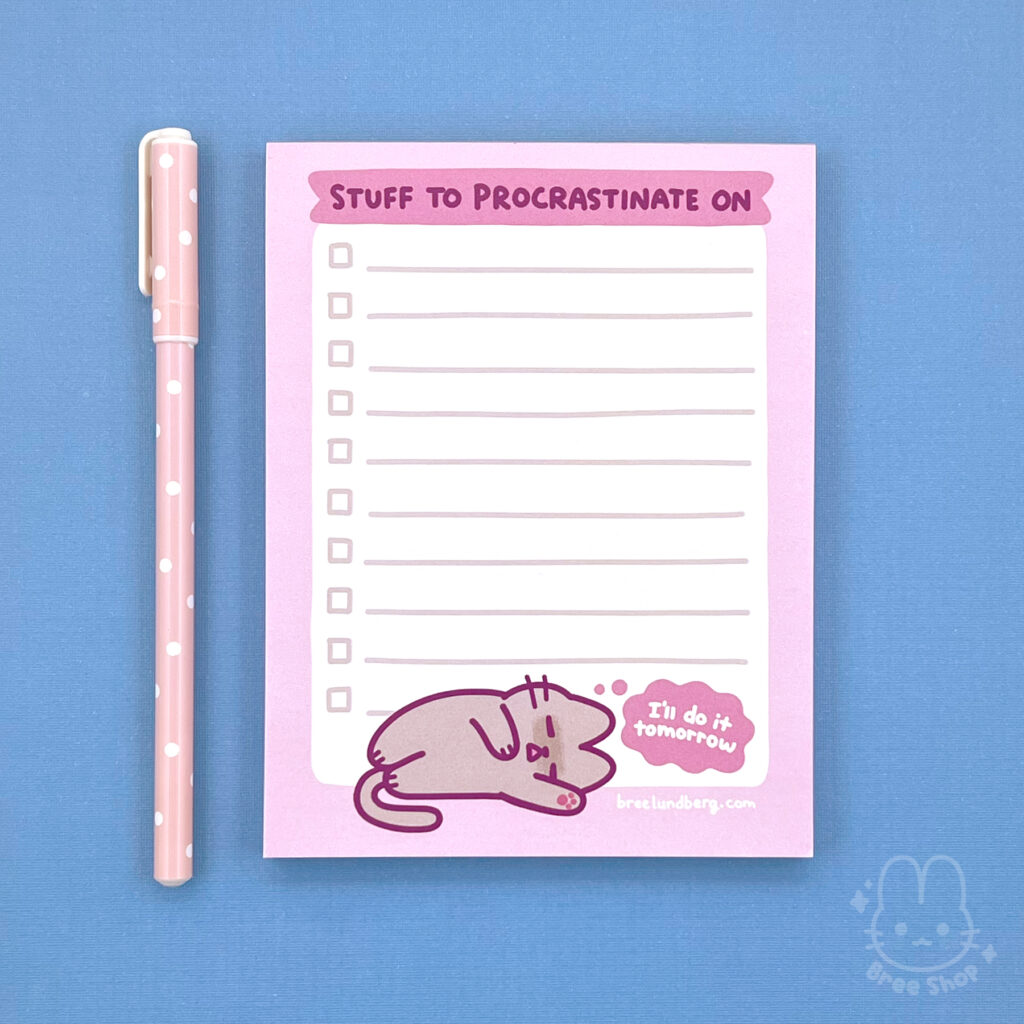 Photo of a lined notepad with a pink border and words at the top say “stuff to procrastinate on”, at the bottom is cute illustrated grey kitty sleeping on its side with a thought bubble saying “I’ll do it tomorrow”.